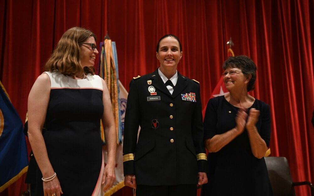 Brig. Gen. Stefanie Horvath (center) is pinned by her wife Christy and her mother Catherine during her promotion ceremony to brigadier general. Photo by Sgt. Sydney Mariette.