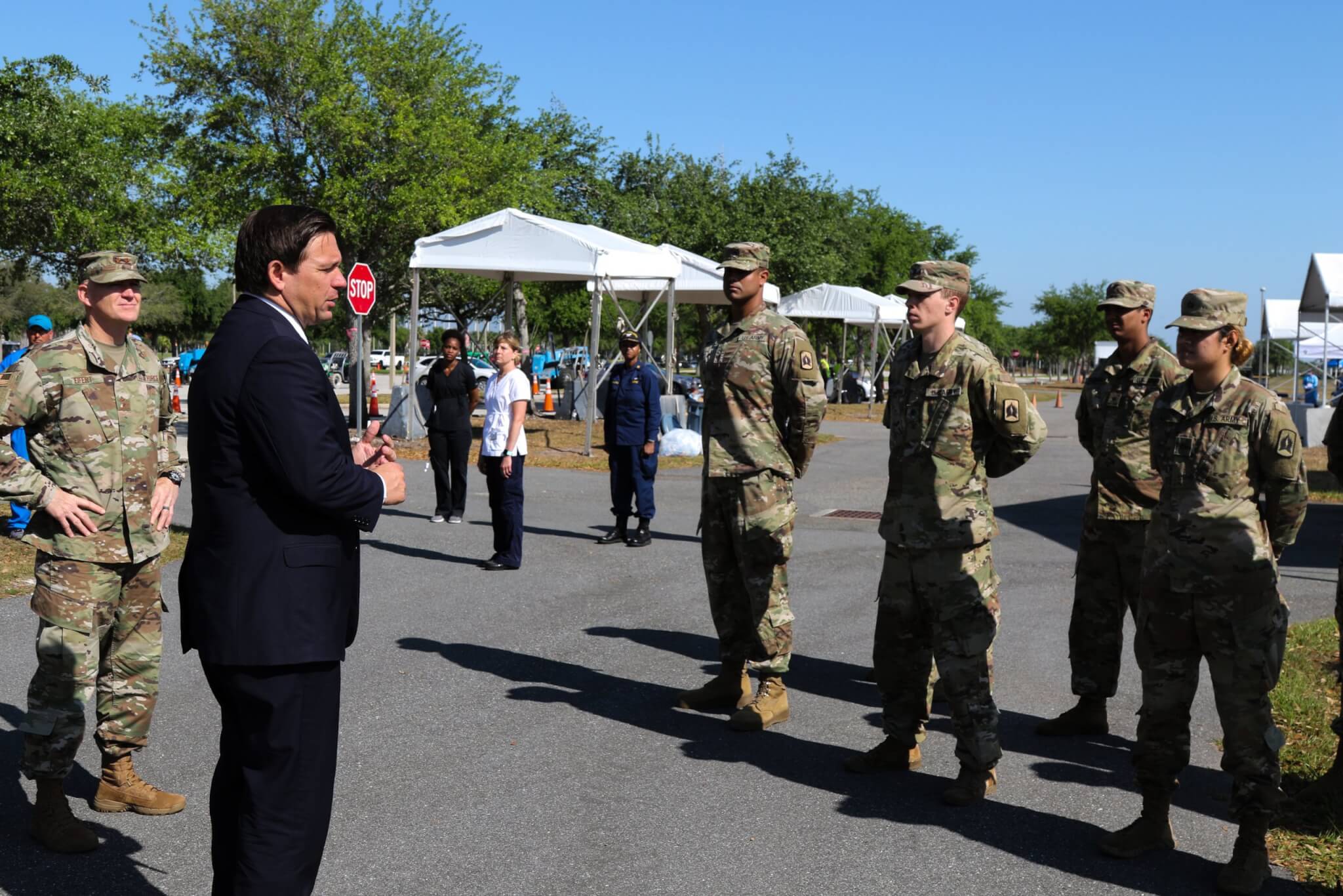Florida Governor Ron DeSantis, along with the Florida National Guard Adj. Gen. James O. Eifert, thanks a group of soldiers who have been working at the Orange County Convention Center Community Based Testing Site as part of the Florida Army National Guard's Task Force Medical. Photo by Sgt. Spencer Rhodes.