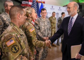 Pennsylvania Gov. Tom Wolf greets members of Pennsylvania National Guard during a press conference on the PA GI Bill. (Department of Military and Veterans Affairs photo by Tom Cherry/Released)