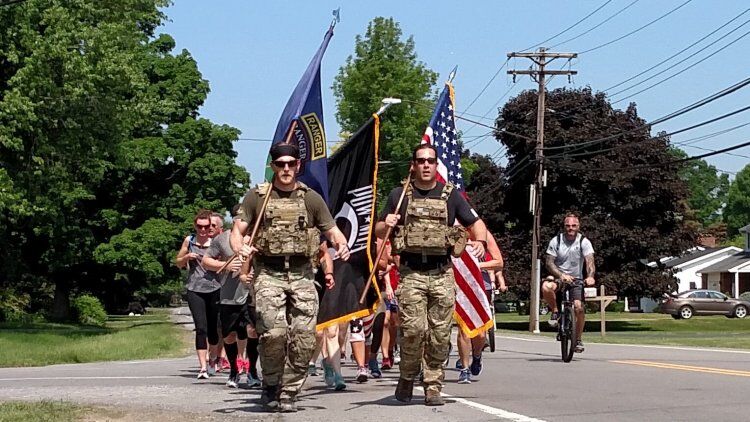 Michael Gomolka, president of Project 33, leads participants of his organization's annual Memorial Day run.