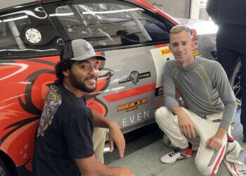 Iowa National Guardsman Spc. Aniekanabasi “Basi” White (left) pictured with NASCAR driver Colin Garrett