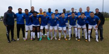 Members of the U.S. Armed Services Football team pose for a group photo at the Lake Myrtle Sports Complex, Auburndale, Florida, Jan. 14, 2024. The team consisted of 17 service members from across the U.S. Armed Forces who were mentored by All-Air Force Soccer coach Jeremiah Kirschman and All-Navy Soccer coach  Jay Reynard. (U.S. Army photo by Sgt. Matthew Lucibello)